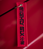 Red X Black Jet Tag